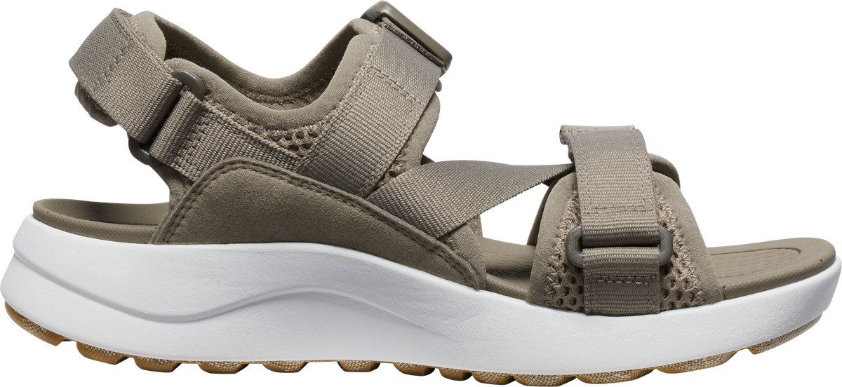 A sandal with adjustable straps and a thick white sole.