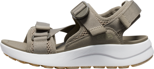 A beige sandal with white platform soles.