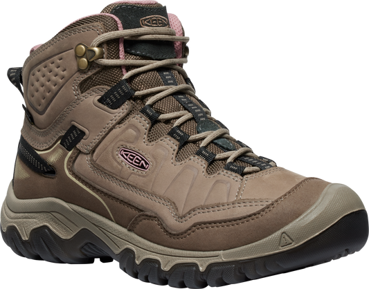 Tan and brown hiking boot with black accents, laces, and metal eyelets.