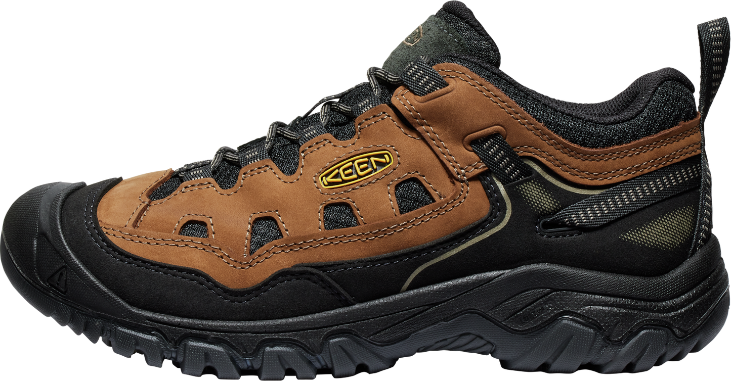 Low-cut hiking shoe with a brown and black upper and a rugged black sole.