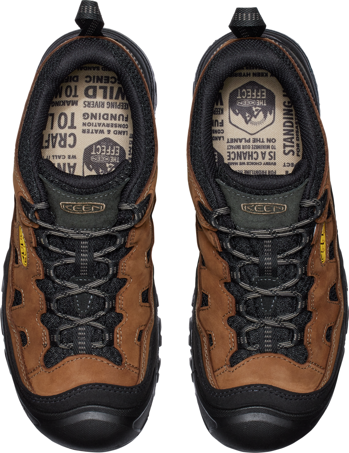 An overhead view of brown and black hiking shoes with black laces and black soles.