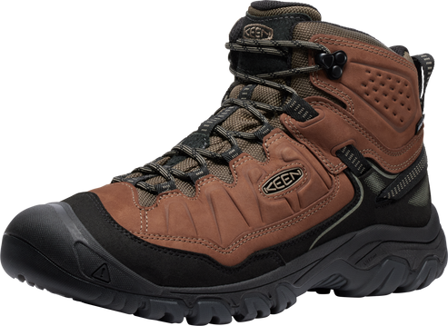 A high-top hiking boot featuring a brown leather upper, black midsole and outsole, toe guard, lace-up closure, and visible logo on the side.