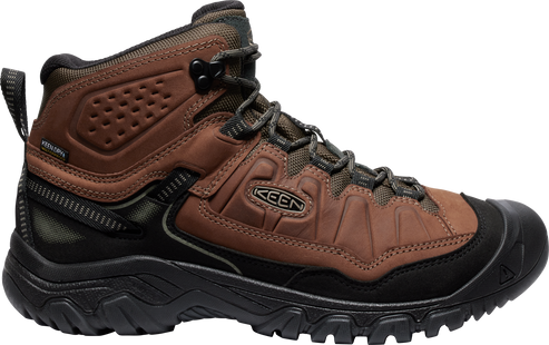 Brown and black hiking boot with textured sole, reinforced toe and heel, and visible "KEEN" logo.