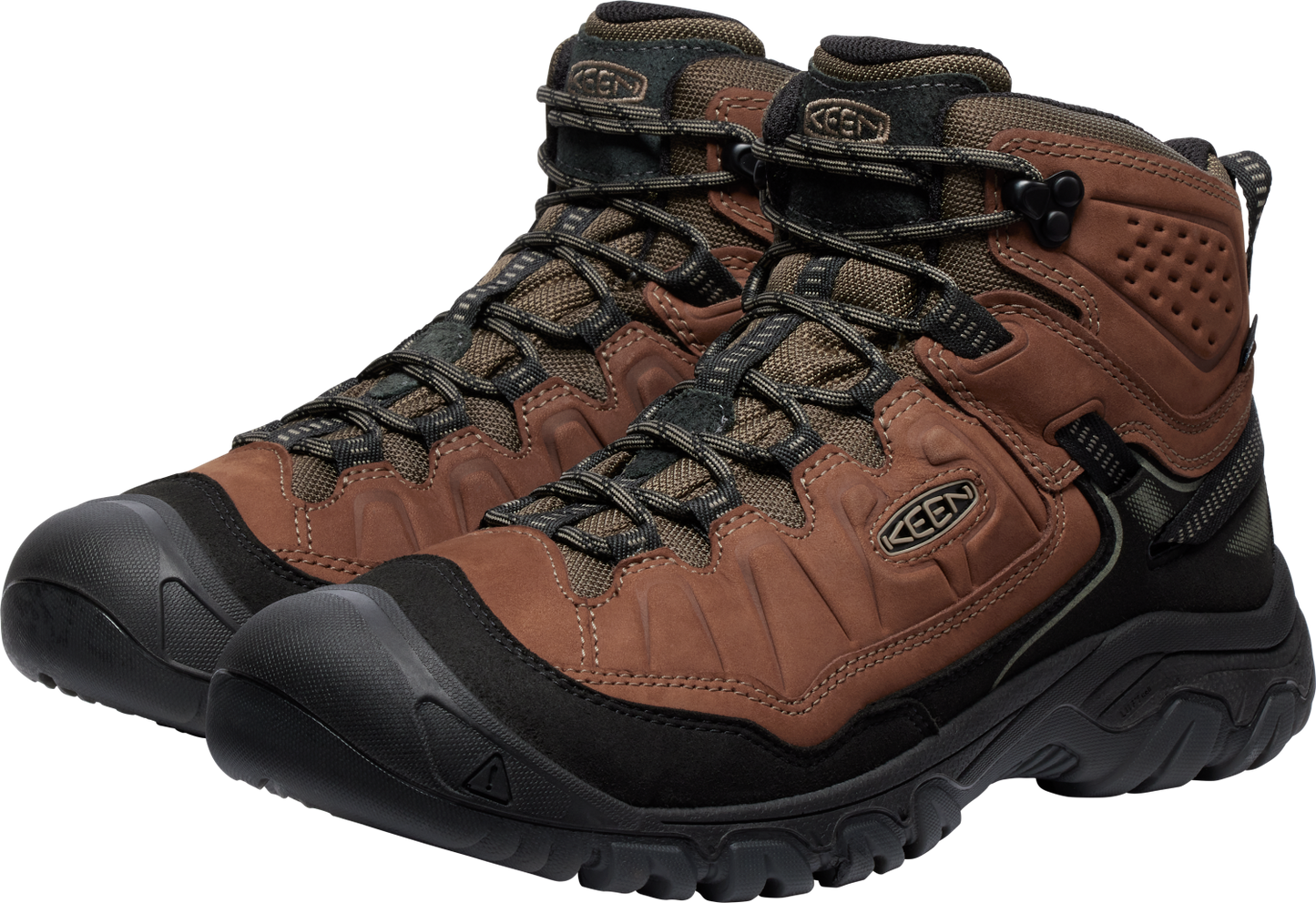 Hiking boots in brown leather with black soles and laces, featuring a rounded toe with a toe cap.