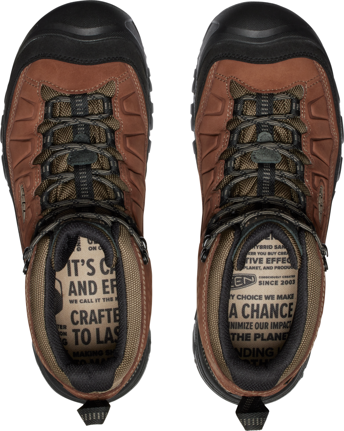 A pair of hiking boots with brown leather uppers, black rubber toe caps, and patterned laces, viewed from directly above, showing the inner linings with printed text.