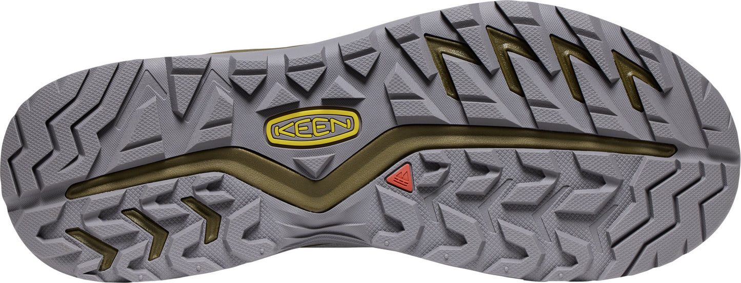 A textured gray rubber shoe sole with black geometric treads and a yellow 'KEEN' logo.