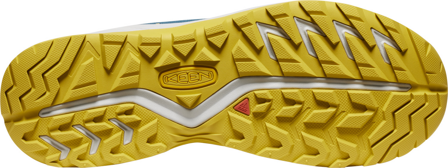 A shoe outsole with a yellow pattern of triangles.
