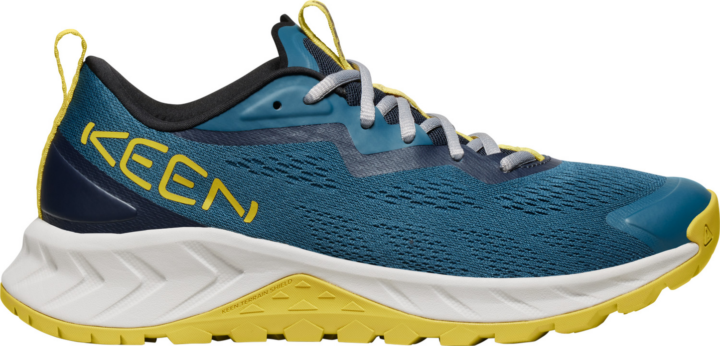 A turquoise sneaker with white laces and a yellow sole and heel.