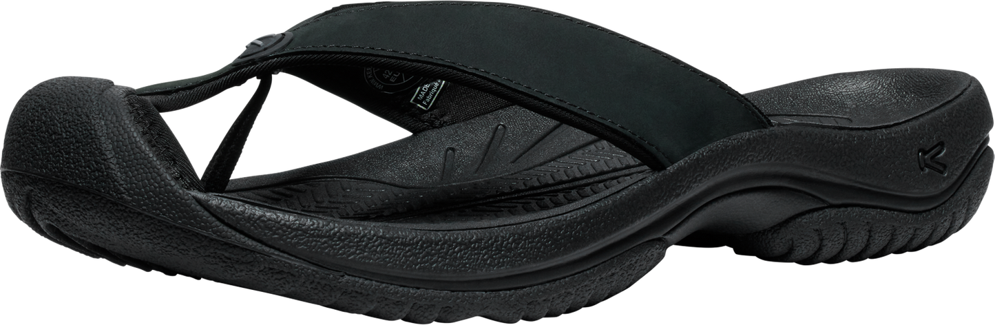A black flip-flop with a rubber sole and strap.