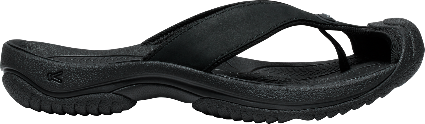 Black flip-flop sandal with thick strap and textured sole.