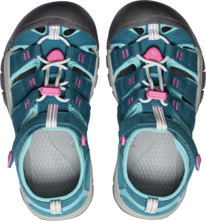 Overhead view of teal sandals with pink accents and velcro straps.