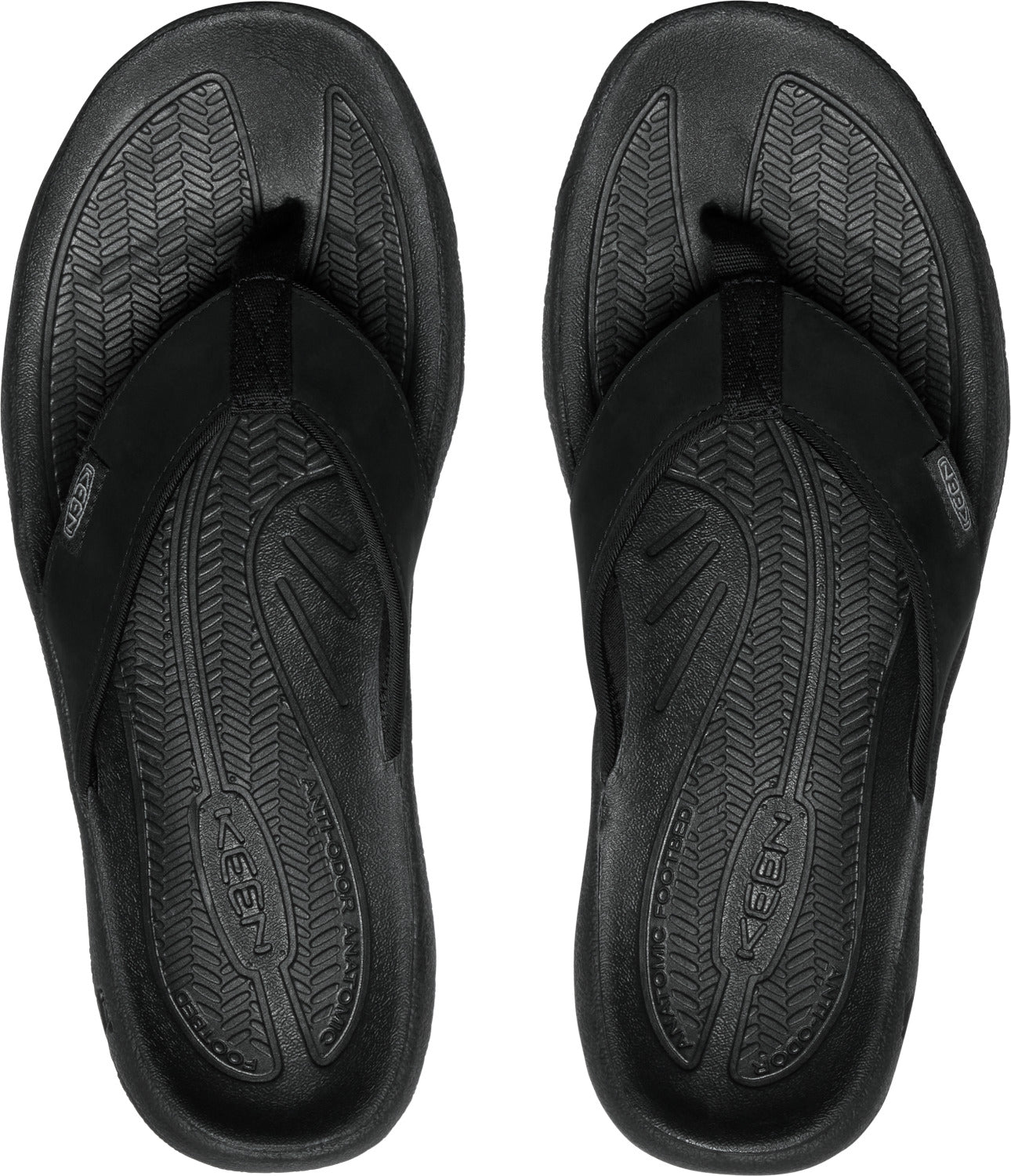A pair of black flip-flops with textured insoles and black straps.
