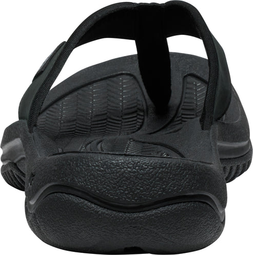 Back view of black flip-flop sandal with textured insole and thick sole.