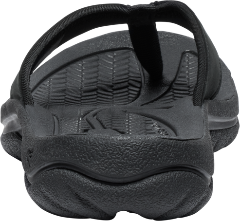 Black flip-flop sandal showing tread and strap.