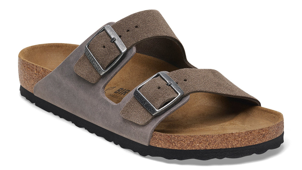 Slip-on sandal with two adjustable straps and buckle closures.