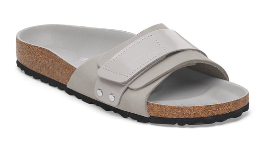 Gray slide sandal with cork midsole and adjustable straps.