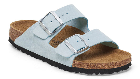 Light blue two-strap sandal with silver buckles and a cork sole.
