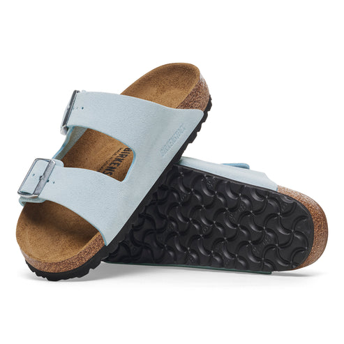 Two light blue, adjustable, two-strap sandals with cork soles.