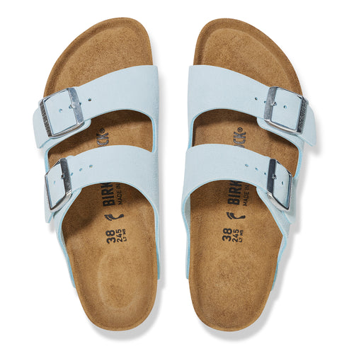Pair of light blue two-strap sandals with silver buckles and cork footbeds.