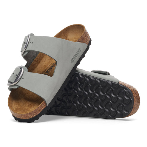 Pair of two-strap sandals with adjustable buckles and textured soles.