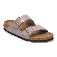 Two-strap slide sandal with metallic gold buckles, cork footbed and black outsole.