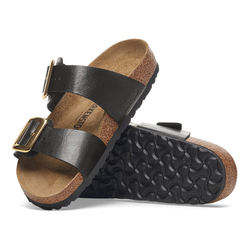 Pair of black, two-strap sandals with gold buckles and a cork footbed.