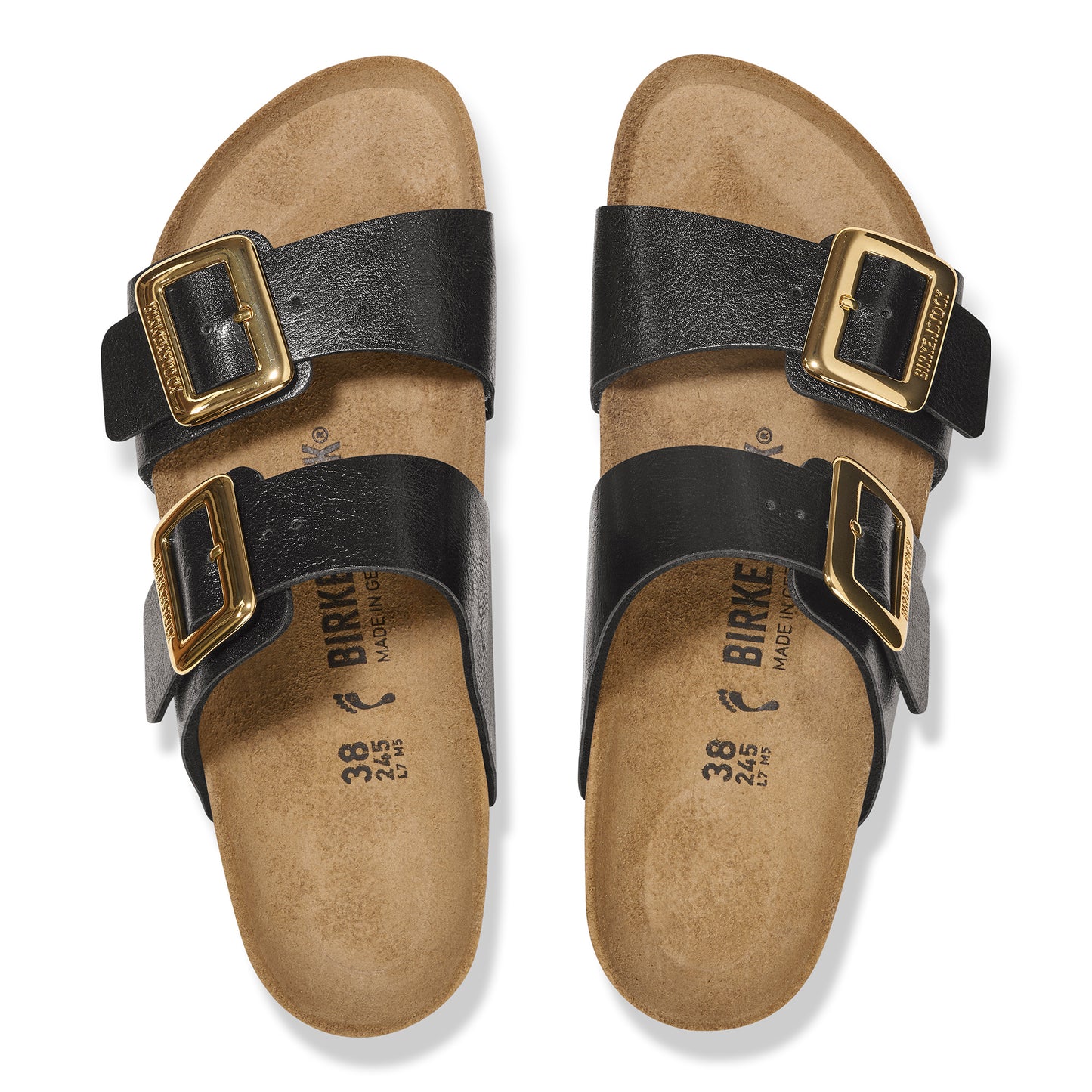 Pair of black sandals with gold buckles.