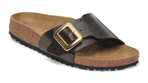 Slide sandal with a large gold buckle and a contoured cork footbed.