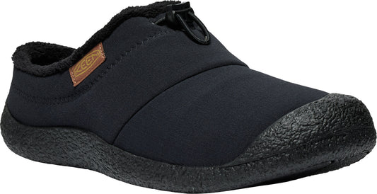 Black slip-on shoe with black sole and toe cap, brown label on side, and elastic opening.