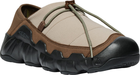 Tan-and-brown slip-on shoe with a thick, black, lugged sole and an elastic cord that adjusts for fit.