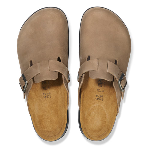 Pair of taupe-colored leather clogs with adjustable straps and buckles.
