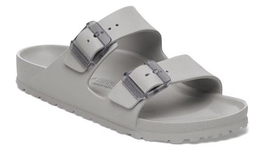 Gray two-strap sandal with silver buckles.