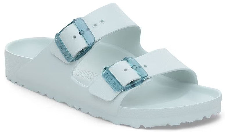 Aqua-colored slide sandal with two adjustable straps and blue buckles.