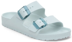 Aqua-colored slide sandal with two adjustable straps and blue buckles.