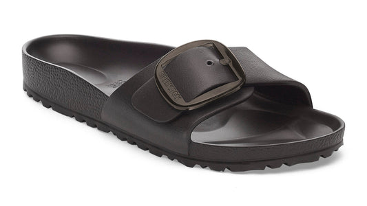 Black slide sandal with oversized buckle.