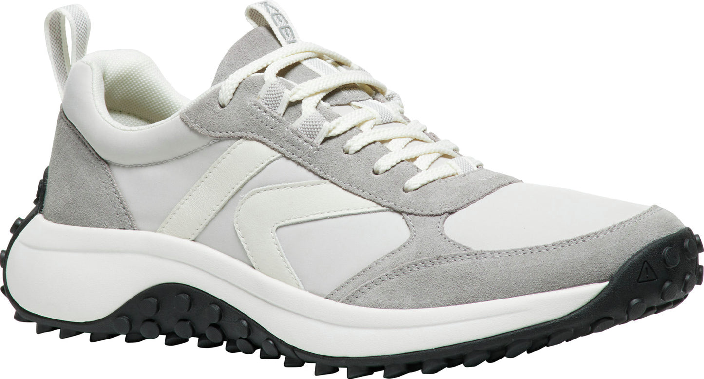 A white and gray sneaker with a thick, black lug sole and white laces.