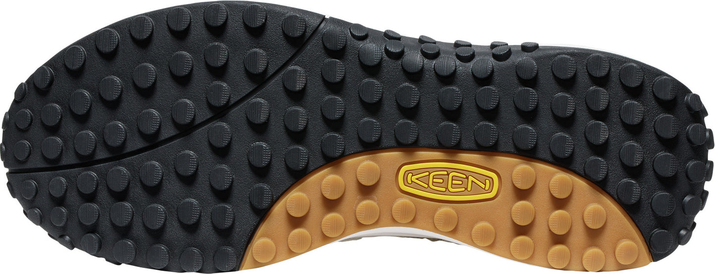 shoe sole with black and brown rubber traction pads and the word KEEN