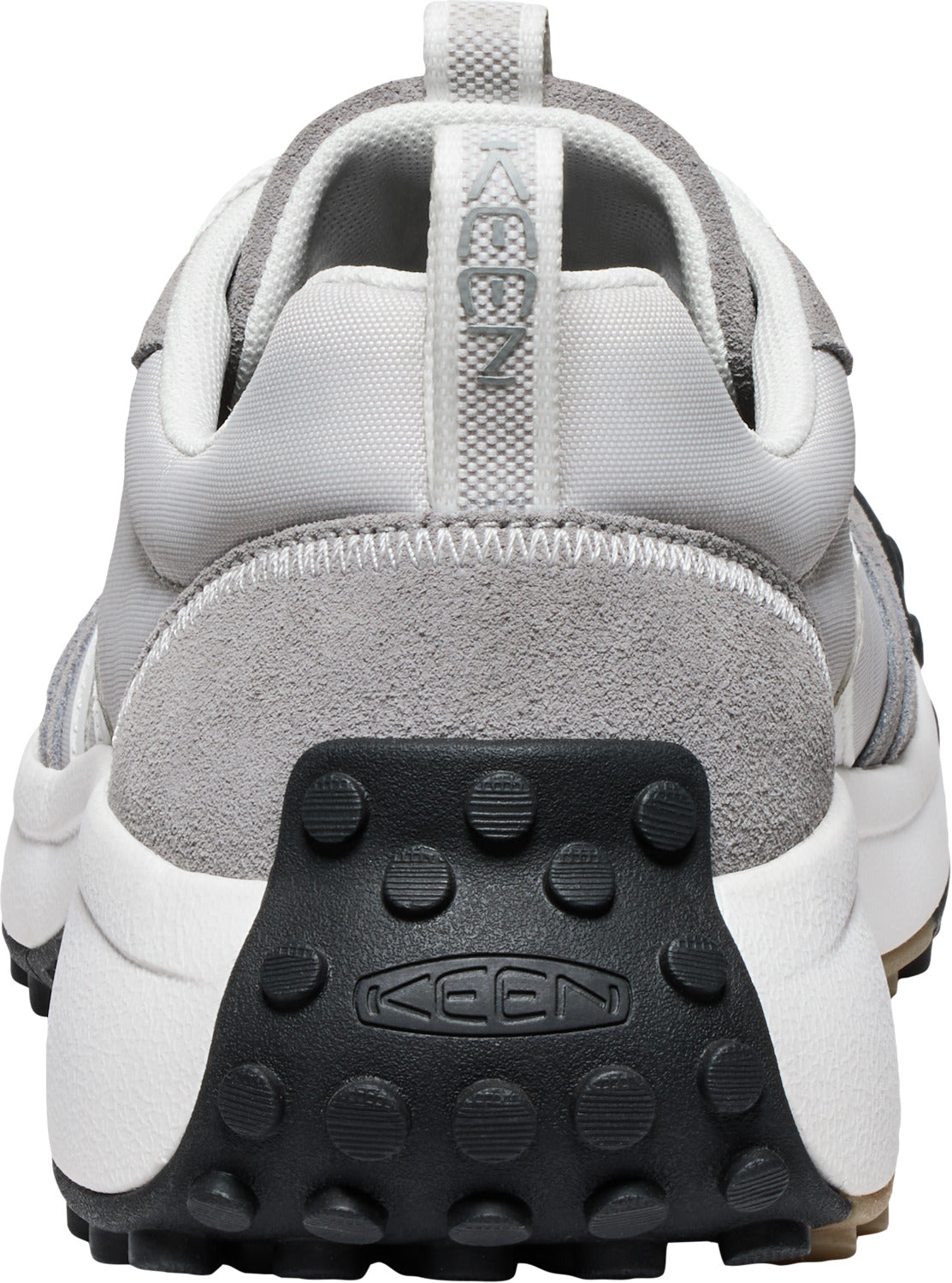 Back view of a gray and white sneaker with a black tread and a pull tab with "KEEN" vertically printed on it.