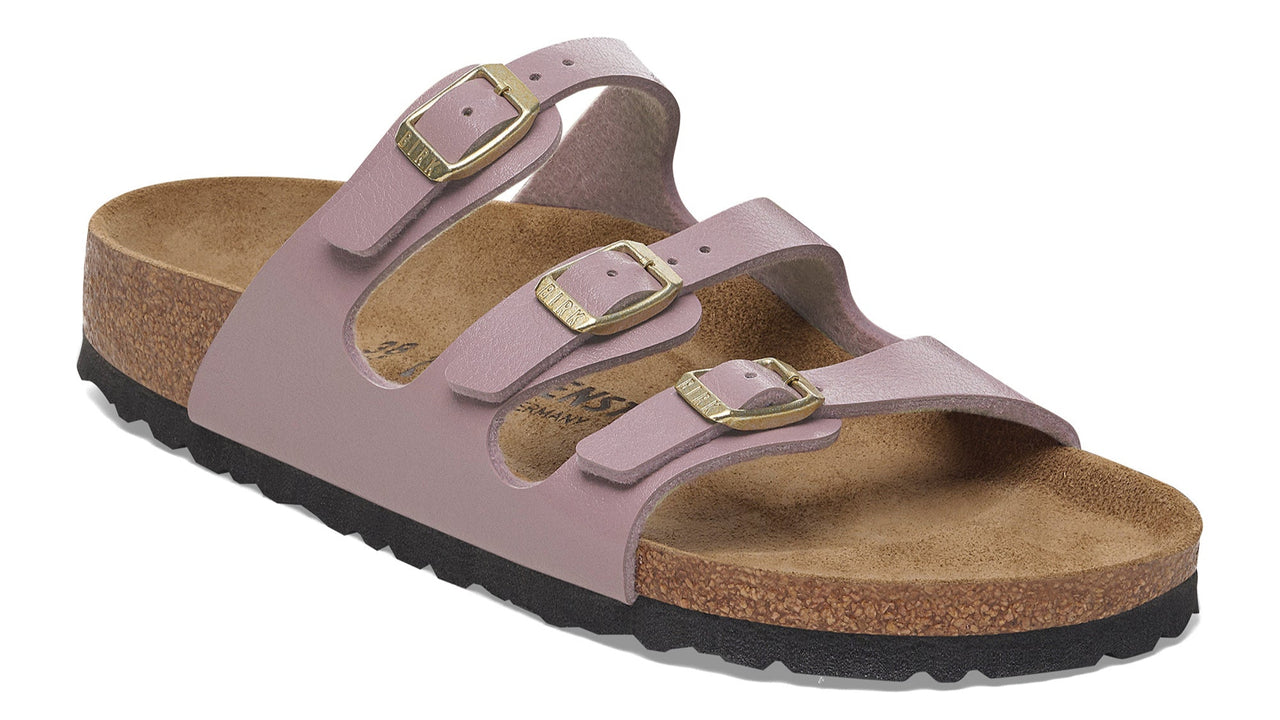 Three-strap sandal with adjustable gold-colored buckles and a contoured footbed.
