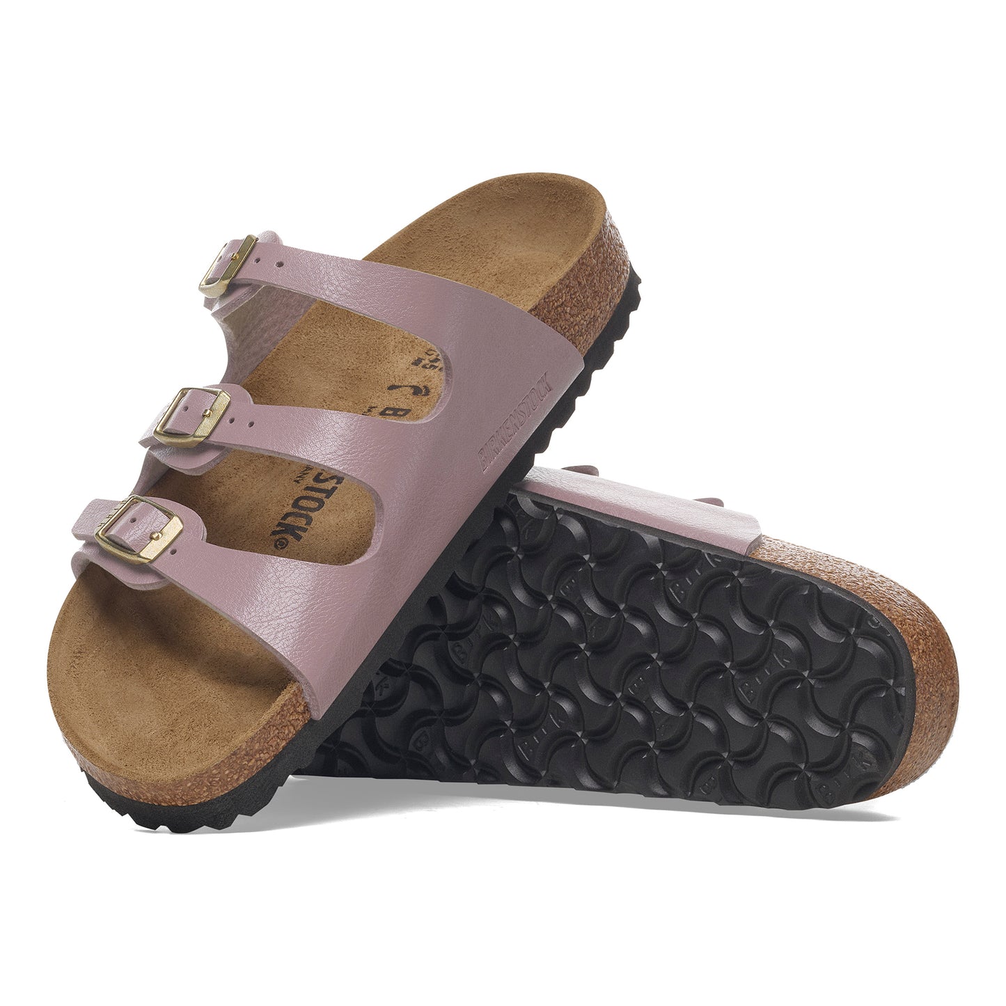 A pair of three-strap lavender sandals with adjustable buckles on a cork sole.