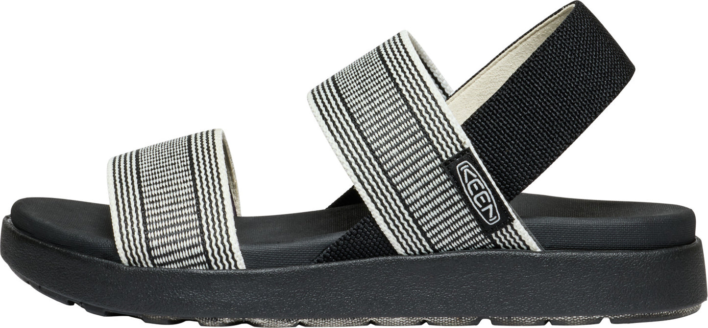Striped black and white sandal with a black sole.