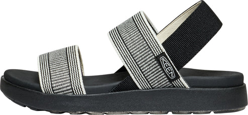 Striped black and white sandal with a black sole.