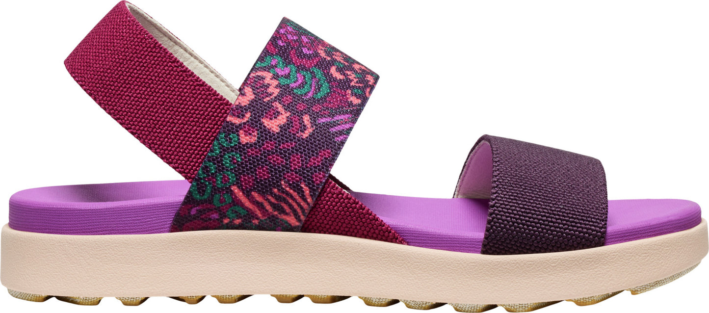 A purple and patterned sandal with a thick, textured sole.
