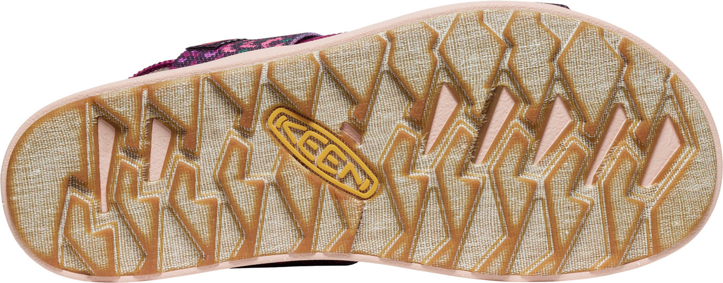 A close-up of the textured sole of a sandal, showcasing a KEEN logo.