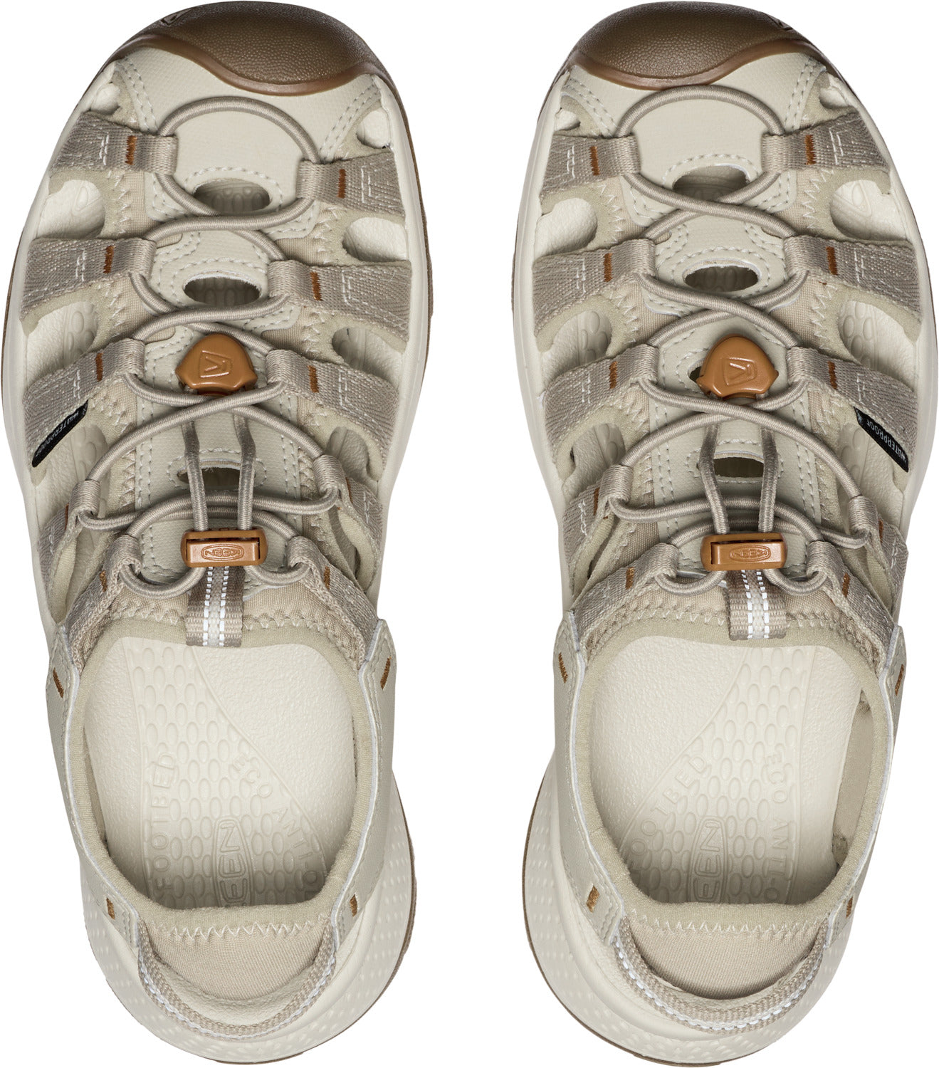 Two beige sandals with bungee cord laces and toe caps, seen from above.