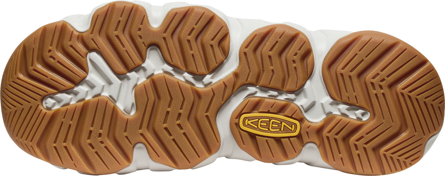 A shoe sole with a textured brown rubber pattern and a yellow "KEEN" logo in the center.