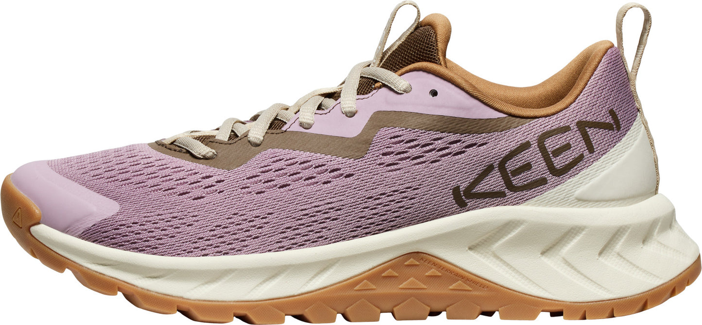 A lavender sneaker with brown accents and the word KEEN.