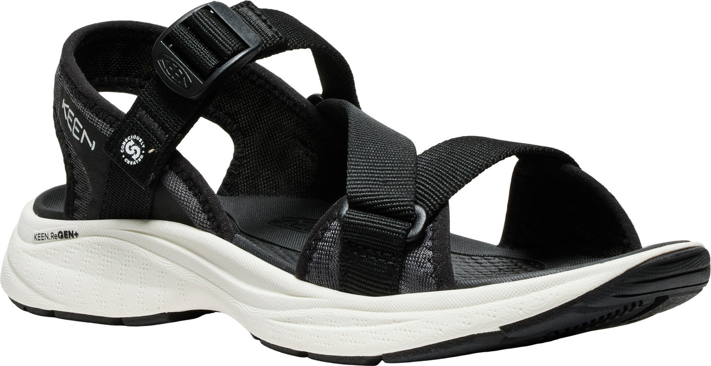 Black sandal with adjustable straps, white midsole and black outsole.