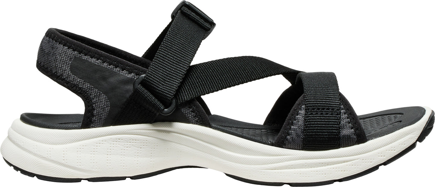 Black sandal with adjustable straps and a thick white sole.