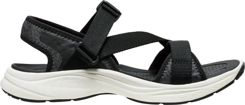 Black sandal with adjustable straps and a thick white sole.